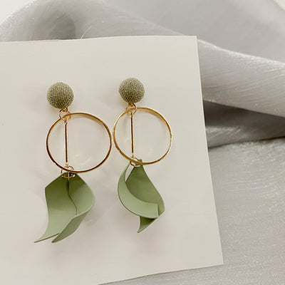 Green Ribbon Dangle Earrings on Grey Background